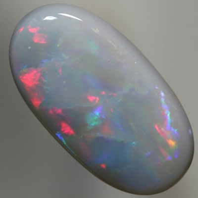 SOLID SEMI BLACK OPAL Bright reds to peacock fire with gold